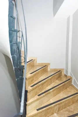 a set of stairs with a metal hand rail at Öz Dünya Suites Apartment in Istanbul