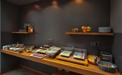 a counter with many different types of food on it at Alilass Hotel in Istanbul