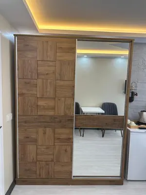 a sliding glass door in a room with a mirror at Palladium APART Hotel in Istanbul