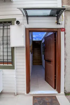 an entrance to a house with a brown door at Palladium APART Hotel in Istanbul
