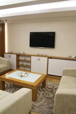 a living room with a flat screen tv on a wall at Besiktas Otel in Istanbul