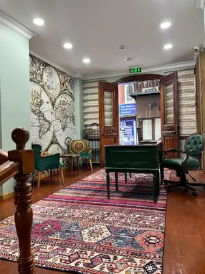 a living room with a pool table and a rug at Dimora Hotel Kadıköy in Istanbul