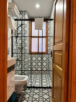 a bathroom with a toilet and a window at Dimora Hotel Kadıköy in Istanbul