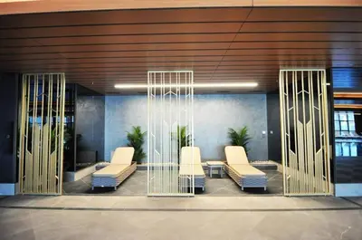 a lobby with white chairs in a building at Scenic Bright Studio w Parking, PoolViews! #302 in Istanbul