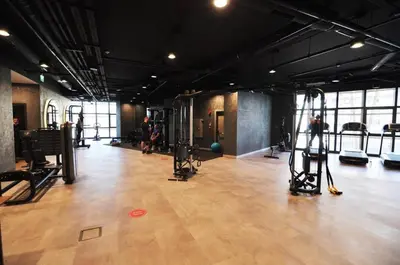 a gym with a bunch of equipment in a room at Scenic Bright Studio w Parking, PoolViews! #302 in Istanbul