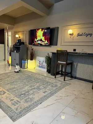 a living room with a flat screen tv on a wall at Park Hotel & Private Transportation İstanbul Airport-By Loft in Arnavutköy