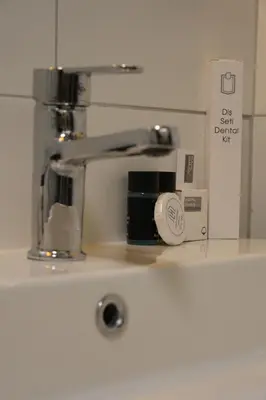 a kitchen counter with a hair dryer and a sink at Park Hotel & Private Transportation İstanbul Airport-By Loft in Arnavutköy