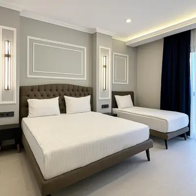 a bedroom with two beds and a window at Park Hotel & Private Transportation İstanbul Airport-By Loft in Arnavutköy
