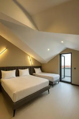 a bedroom with two beds and a window at Park Hotel & Private Transportation İstanbul Airport-By Loft in Arnavutköy