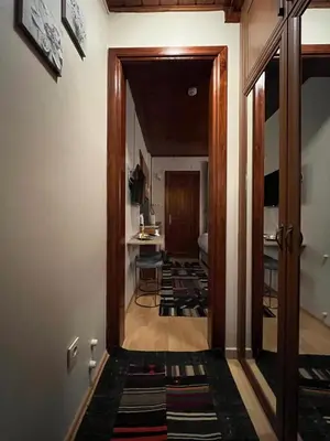 a hallway with a door leading to a dining room at Lily Mansion in Istanbul