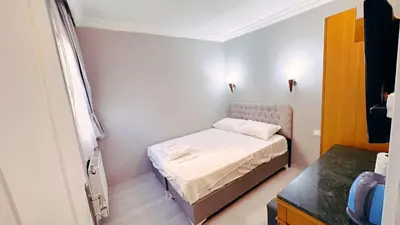 a small room with a small bed in it at Taksim Centre Hotel in Istanbul