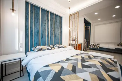 a bedroom with a large bed and a large window at Megalos Galata Hotel in Istanbul
