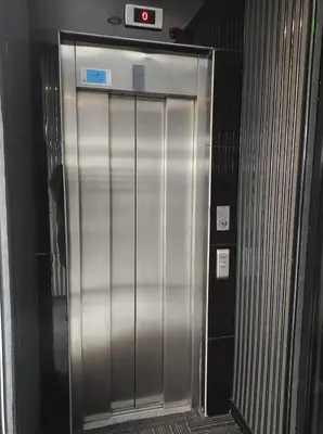 a elevator in a building with a sign on it at GRANDROYAL HOTEL in Gümüşyaka
