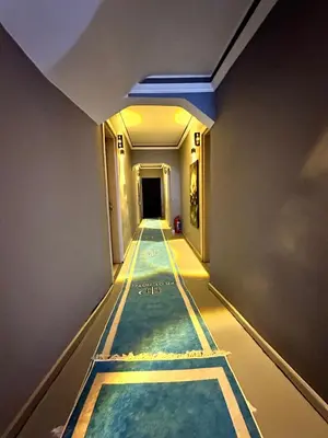 a swimming pool in a building with a long corridor at pilot hotel in Arnavutköy