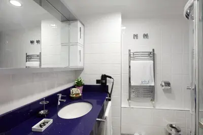 a bathroom with a sink and a shower at Lir Residence Suites LONG STAY in Istanbul