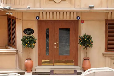 a front door of a building with two vases at Lir Residence Suites LONG STAY in Istanbul