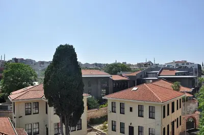 a view of a city with buildings and a tree at Hotel Baykal in Istanbul