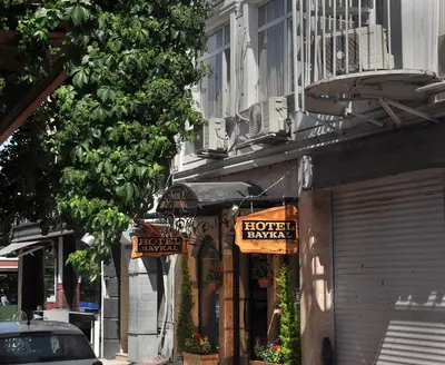 a store with signs on the side of a building at Hotel Baykal in Istanbul