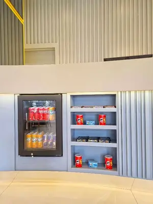 a refrigerator filled with drinks in a room at Hampton By Hilton Sakarya in Sakarya