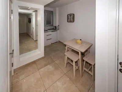 a kitchen with a table and chairs in a room at BGuest Hotel & Residence in Istanbul