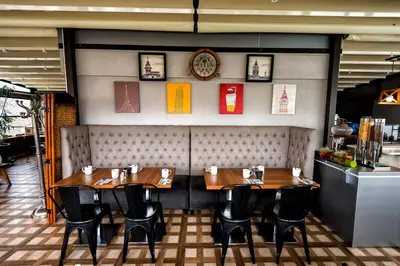 a restaurant with wooden tables and chairs in a room at BGuest Hotel & Residence in Istanbul
