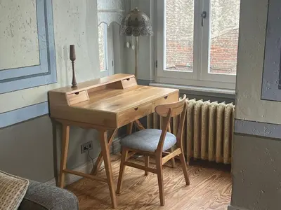 a wooden desk with a chair in a room at Stylish City Getaway-Explore the Urban Delights in Istanbul