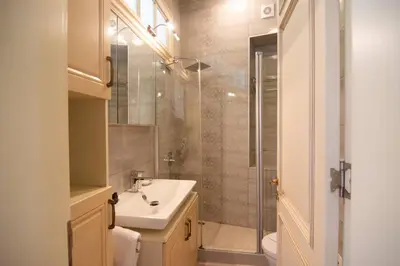 a bathroom with a sink and a shower at Stylish City Getaway-Explore the Urban Delights in Istanbul