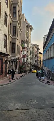 an empty street in a city with tall buildings at Stylish City Getaway-Explore the Urban Delights in Istanbul