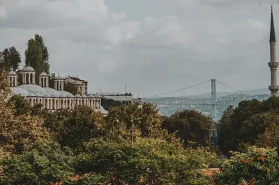 a building with a mosque and a bridge in the background at Selvese Suites, Serviced Living in Galata in Istanbul