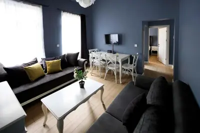 a living room with a couch and a table at Selvese Suites, Serviced Living in Galata in Istanbul