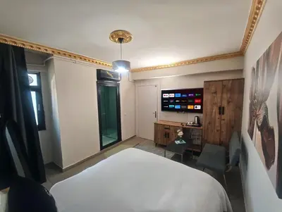 a bedroom with a bed and a tv in it at Royal Hotel Kumkapı in Istanbul