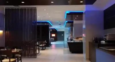 a restaurant with a bar and some tables and chairs at FEZ INN Hotel in Istanbul