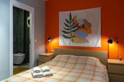 a bedroom with a bed with two towels on it at Cosy flat with a garden in central Kadikoy in Istanbul