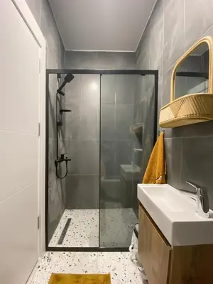 a bathroom with a shower and a sink at Cosy flat with a garden in central Kadikoy in Istanbul