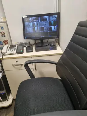 a computer monitor sitting on a desk with a chair at Hotel Hoyuk in Istanbul