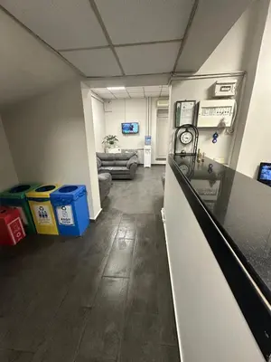 a room with a kitchen and a living room at Hotel Hoyuk in Istanbul