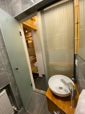 a bathroom with a sink and a mirror at Bunkahaus in Istanbul