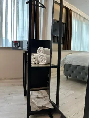 a room with a bunk bed with towels on a shelf at Monezza Maltepe Rezidans in Istanbul