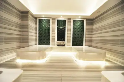 a spa room with two sinks and two windows at Beautiful Bright Deluxe 1BD Condo PoolViews! #311 in Istanbul