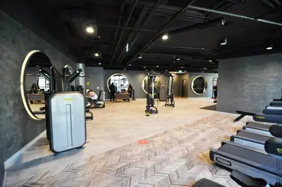 a gym with dumbbells and exercise equipment in a room at Beautiful Bright Deluxe 1BD Condo PoolViews! #311 in Istanbul