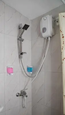 a shower in a bathroom with a shower head at Noya Suites in Istanbul