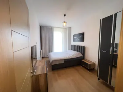 a small bedroom with a bed and a window at Central Location Free WIFI AC Parking Garage in Esenyurt