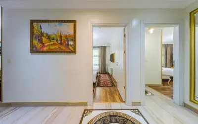 a hallway with a painting hanging on a wall at Lemis Suite Istanbul in Istanbul