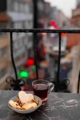 a plate of cookies and a cup of tea on a table at Rubby Kadıköy in Istanbul