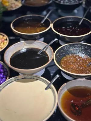 a bunch of pots filled with different types of food at THE PARK HOTEL in Istanbul