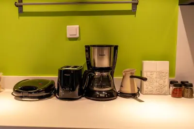 a kitchen counter with a blender and other items on it at İstanbul Smart Apart by SUMMITVISTA in Istanbul