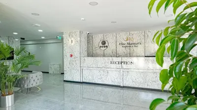 a lobby with a reception area with plants at Elite Marmara Bosphorus Çamlıca in Istanbul