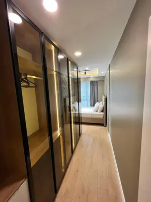 a hallway with sliding glass doors and a living room at Serim Residence in Kocaeli