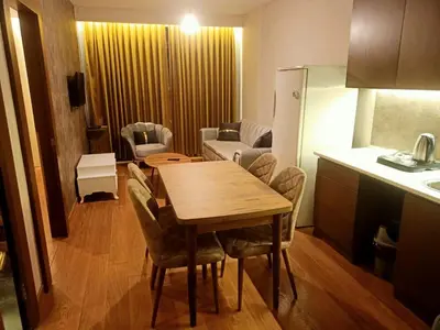 a kitchen and dining room with a table and chairs at Doğan Palace Hotel in Istanbul