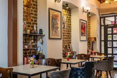 a row of tables in a restaurant with chairs at Taksim Trust Hotel in Istanbul